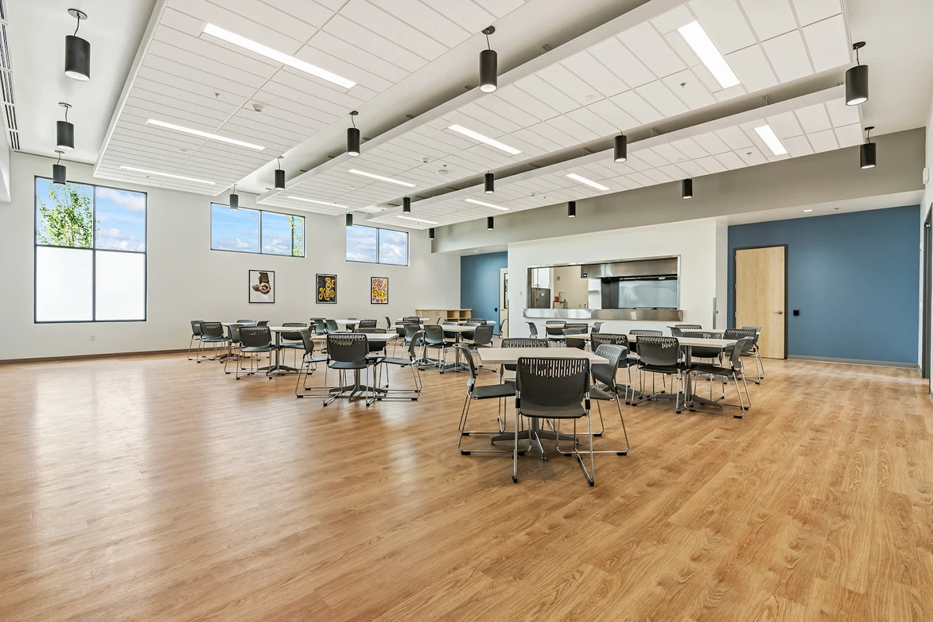 Spacious group therapy room with chairs and tables