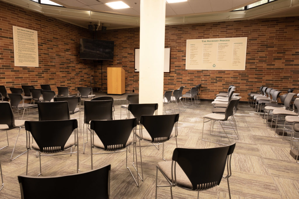 Group therapy room with chairs and presentation area