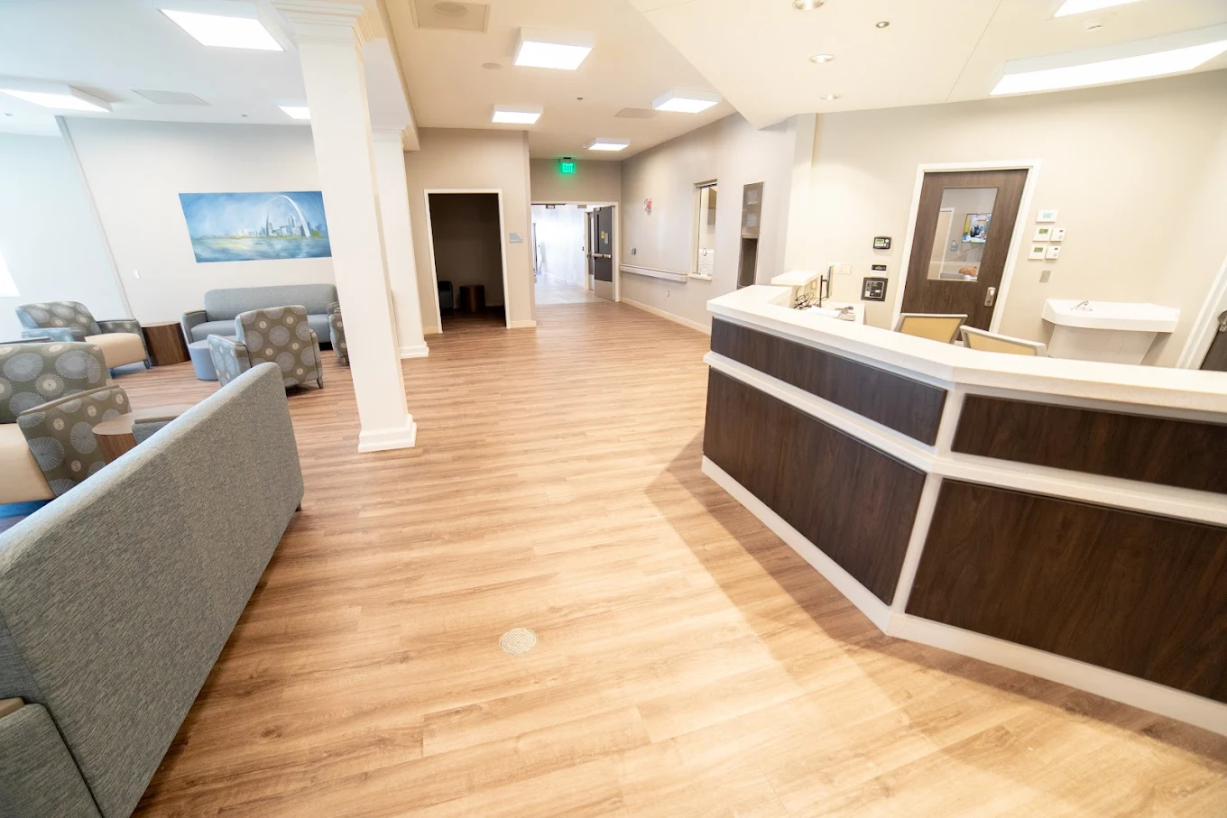 Reception desk with adjacent waiting area and seating