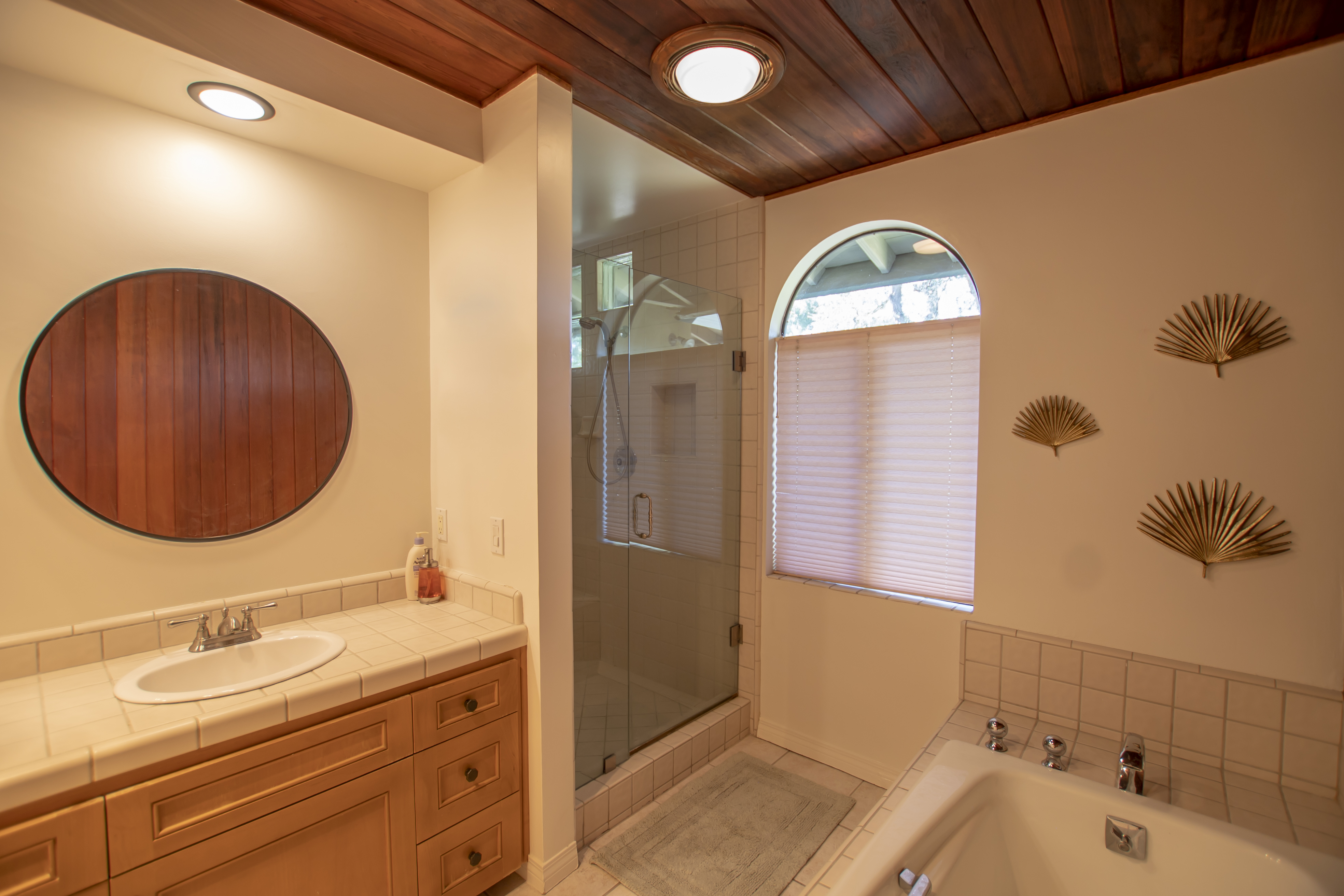 Bathroom with walk-in shower and wood accents