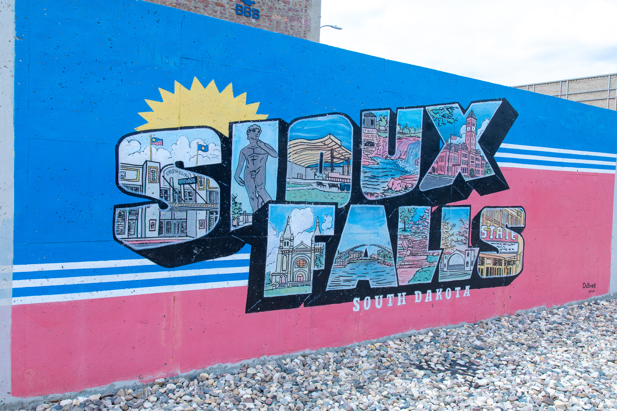 Colorful Sioux Falls mural featuring local landmarks