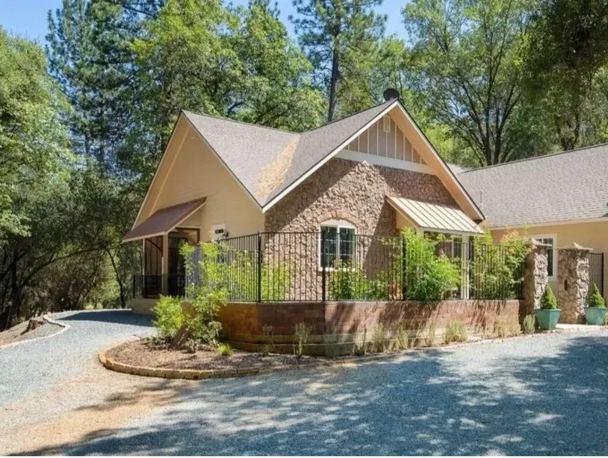 Front view of the rehab facility surrounded by tall trees
