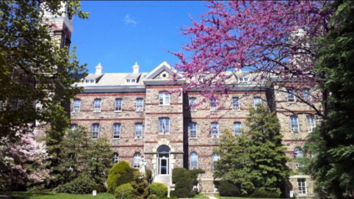 Brick building with trees and blue sky