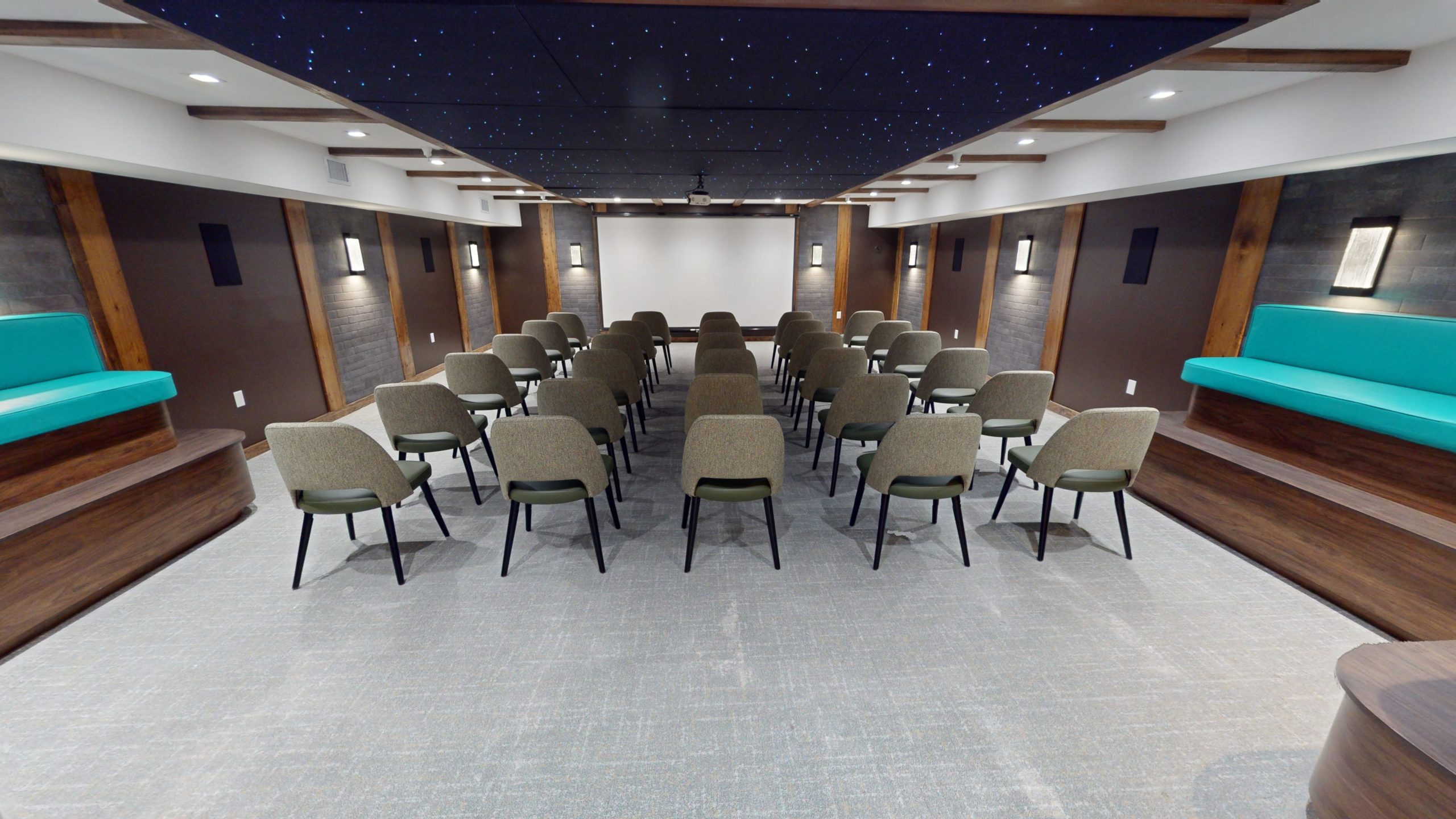 Group room with chairs facing screen for therapy sessions