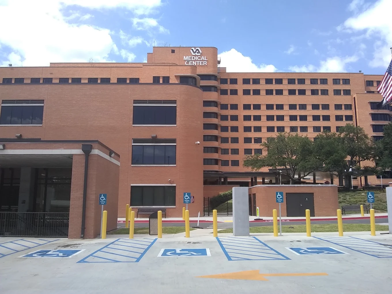 Brick VA medical center exterior with accessible parking spaces