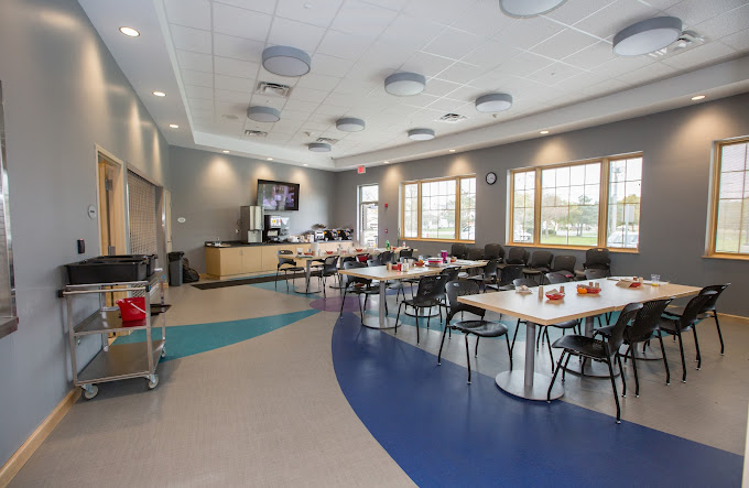 Spacious dining area with tables, chairs, and buffet station