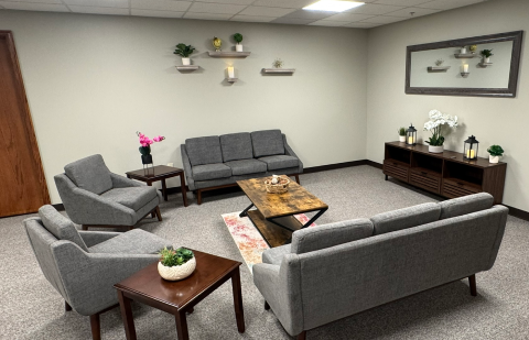Community lounge with sofas, chairs, and coffee table