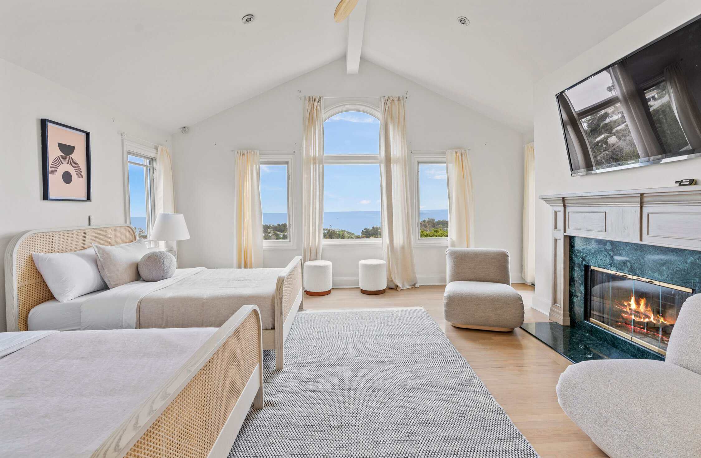 Bedroom suite with fireplace and panoramic ocean view