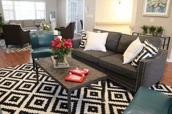 Modern lounge with couch, chairs, and coffee table