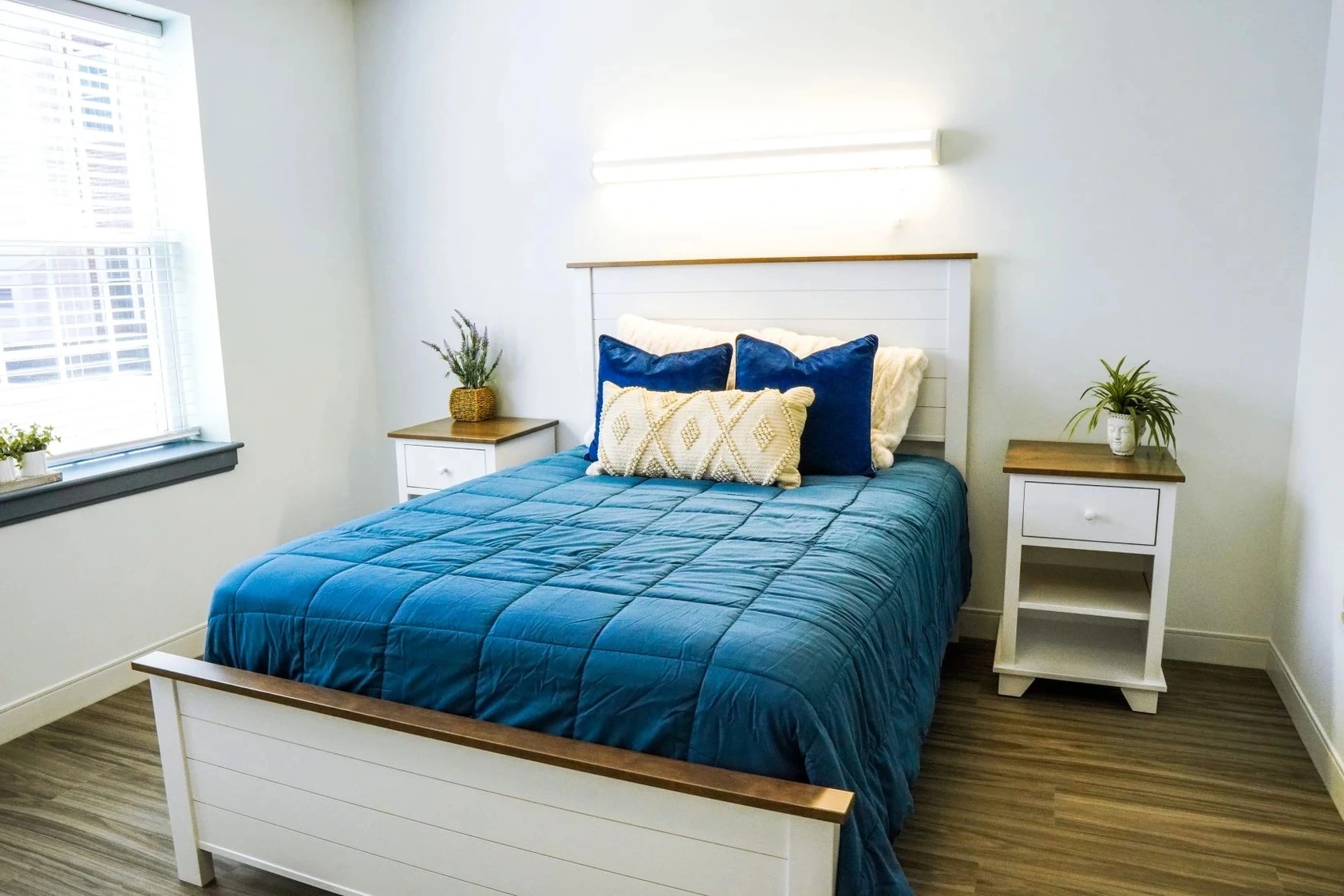 Private bedroom with a bed and side-tables.