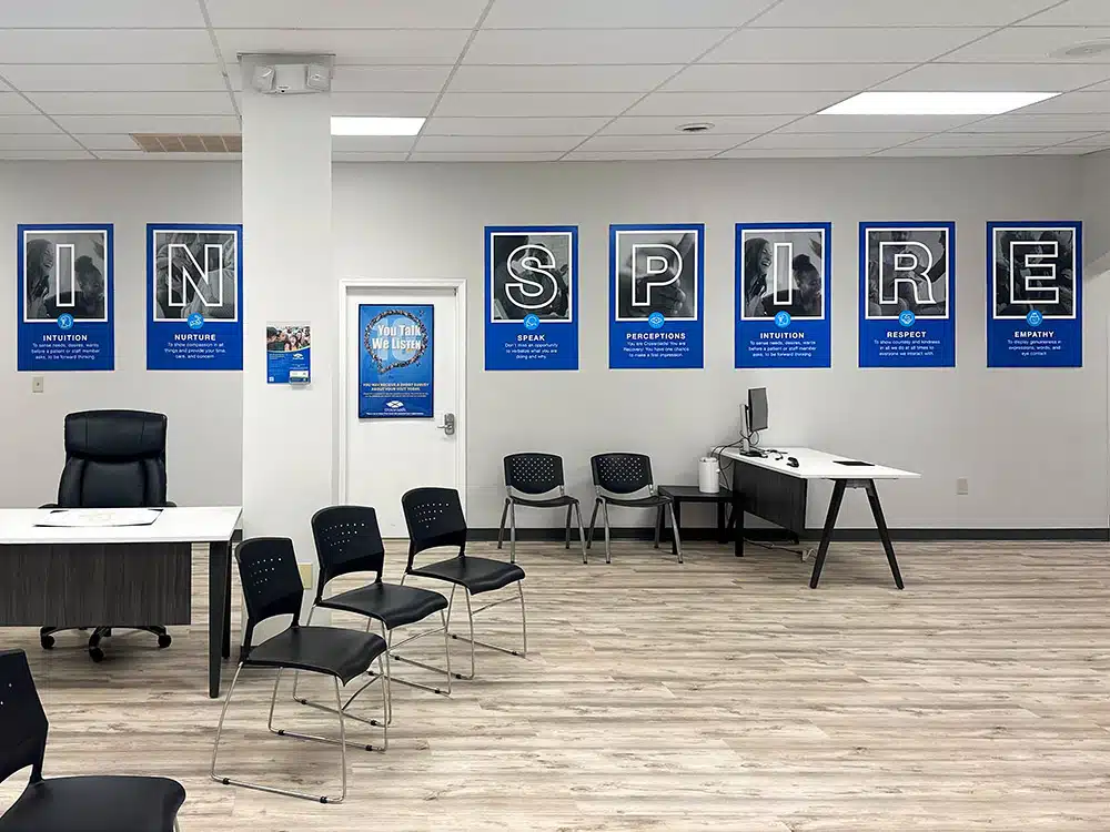Office with chairs and Inspire posters on wall