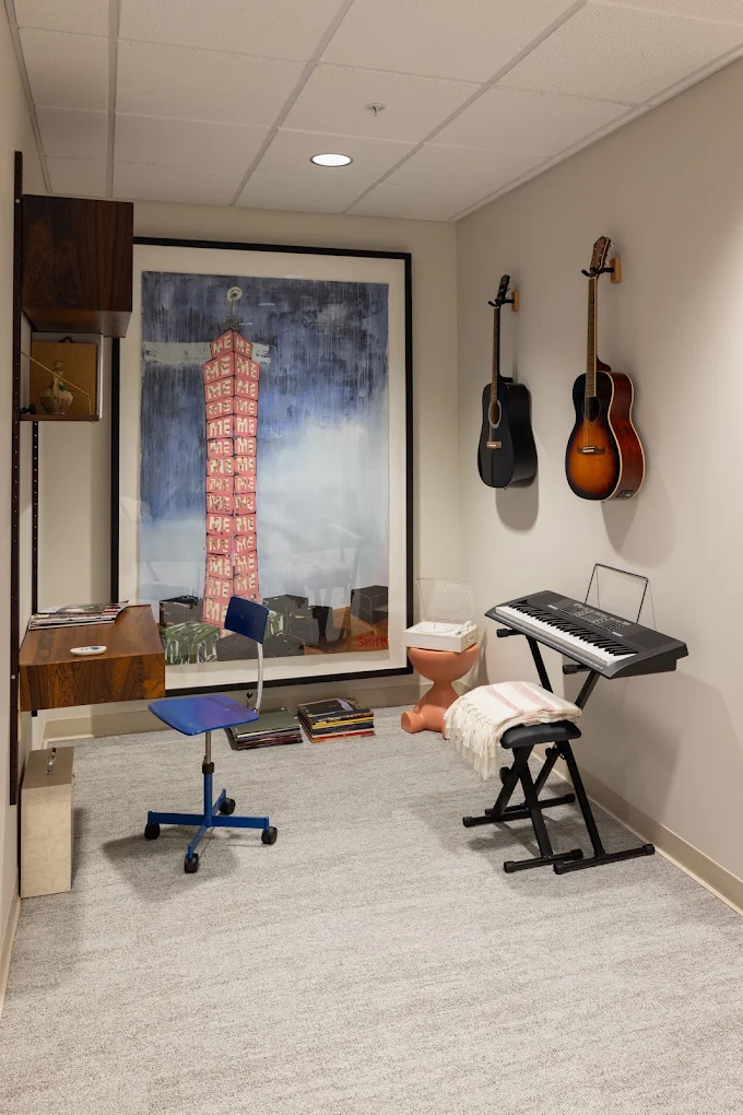 Music room with keyboard and guitars mounted on the wall