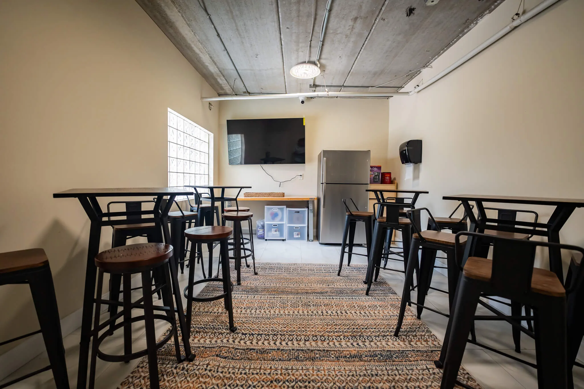 Indoor dining room with tall tables and chairs