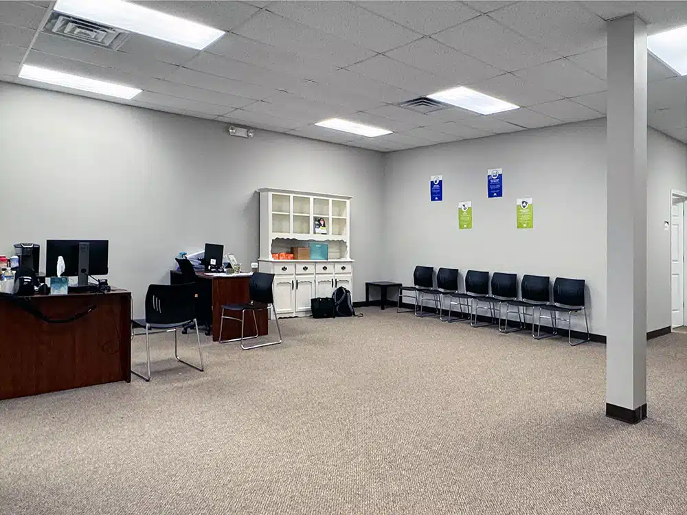 Lobby with seating and staff desk at treatment center