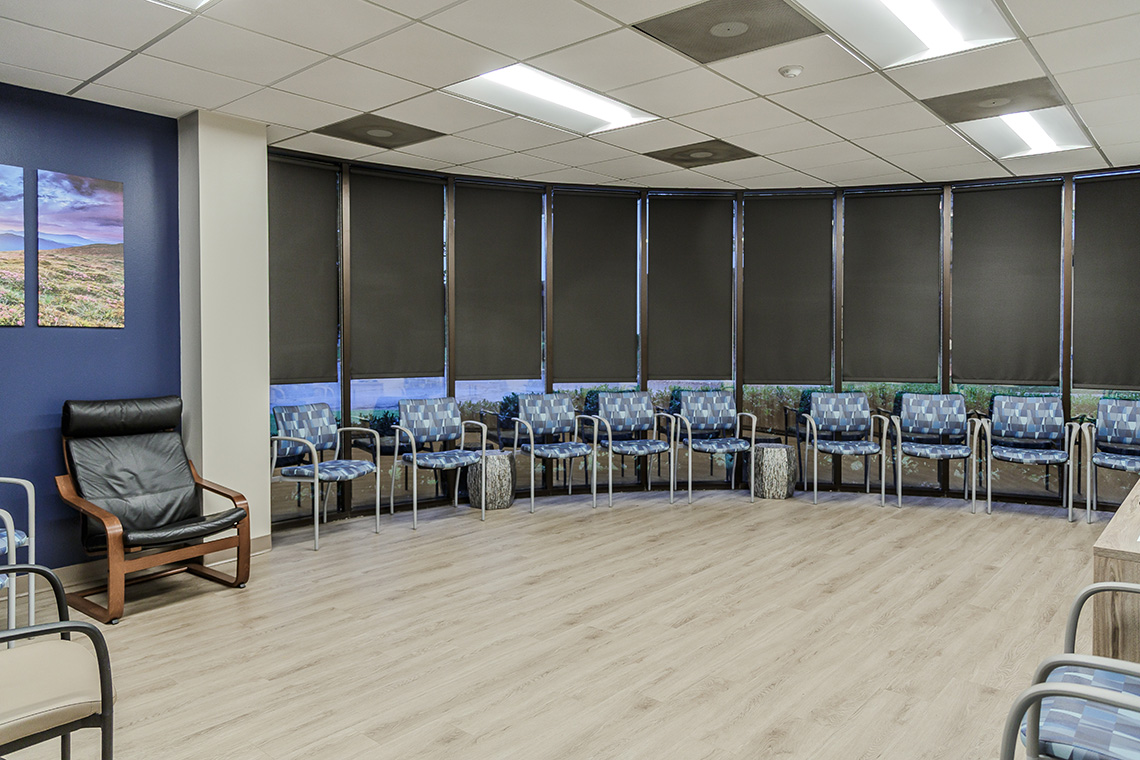 Meeting area with chairs arranged along the wall