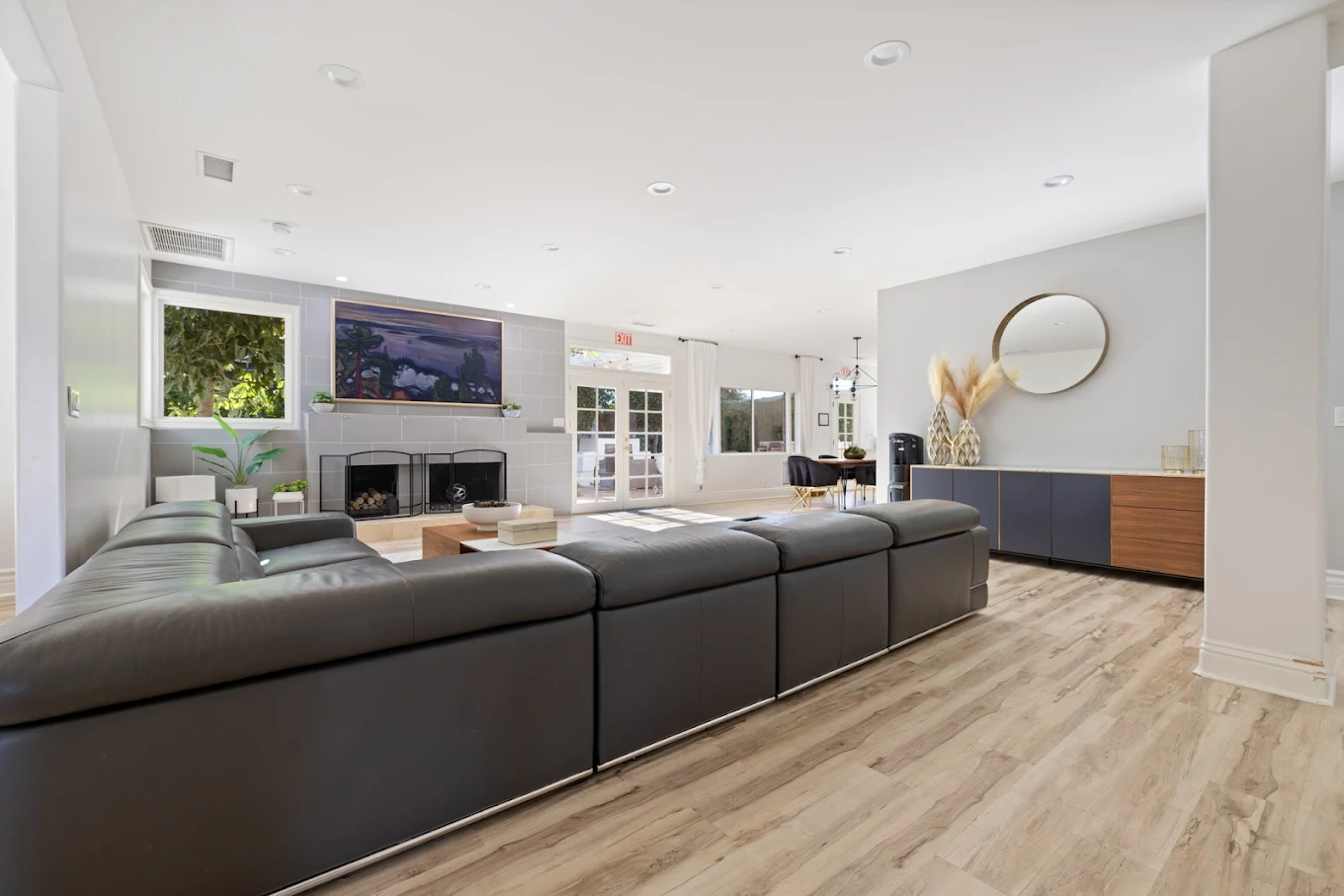 Large living area with sectional couch and fireplace