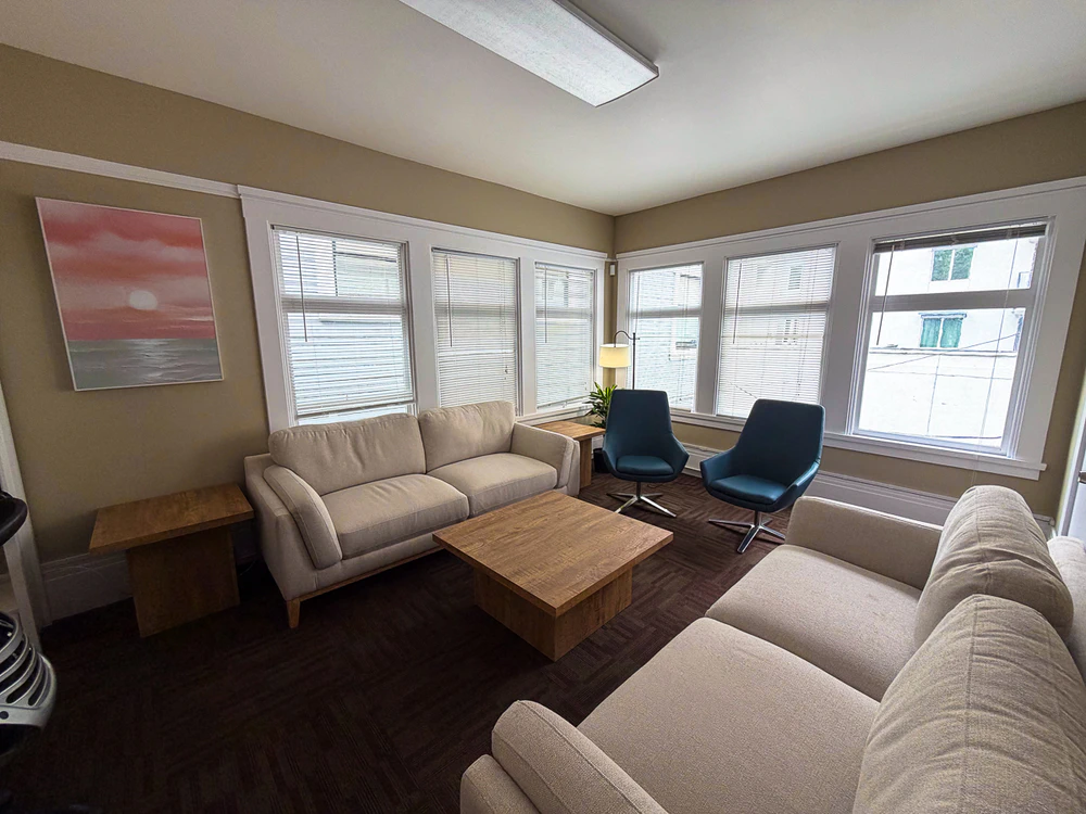 Bright therapy lounge with sofas and lounge chairs