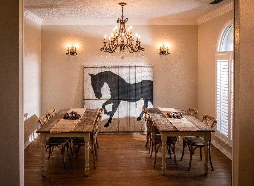 Dining room with rustic tables and chandelier lighting