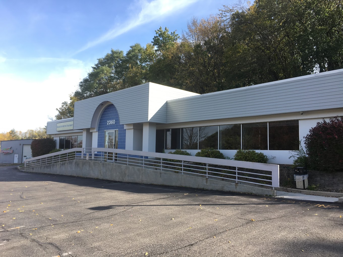 Facility front entrance with accessible parking.