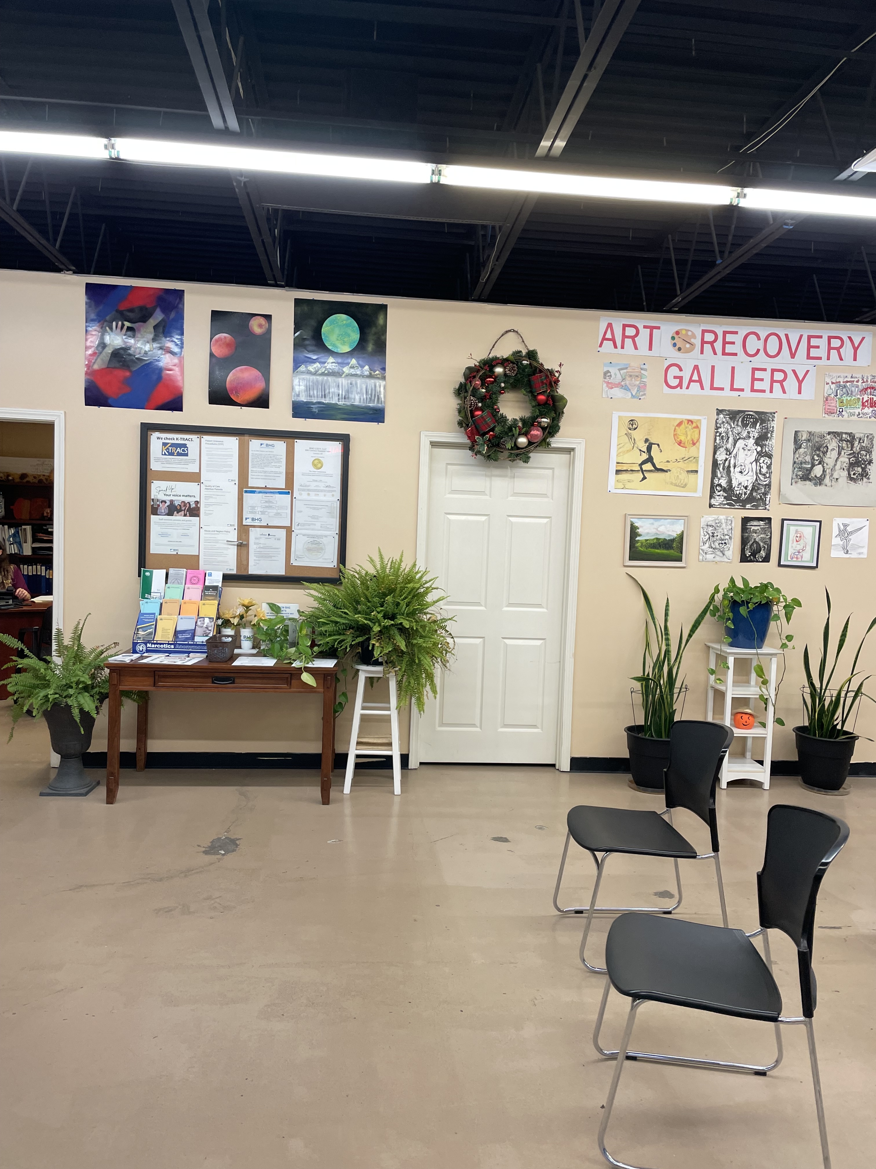 Spacious lobby with seating and recovery art display