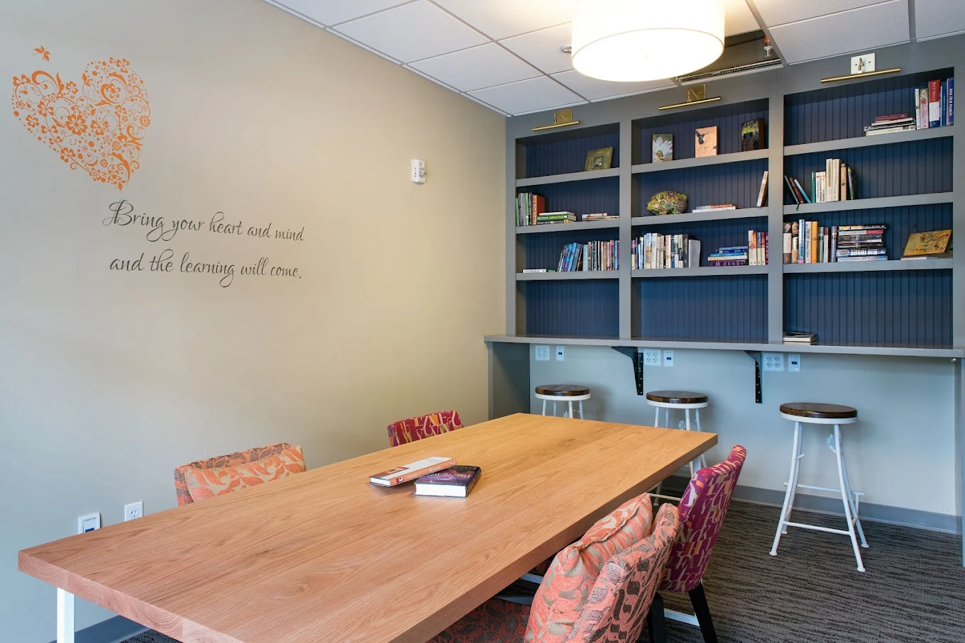 Library and study area with bookshelves and large table
