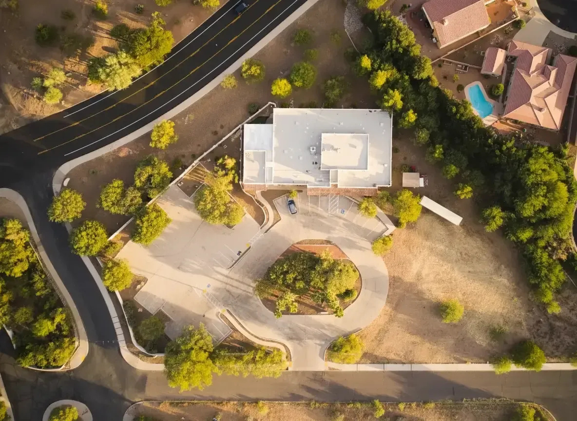 Drone view directly above the facility and surrounding landscape.