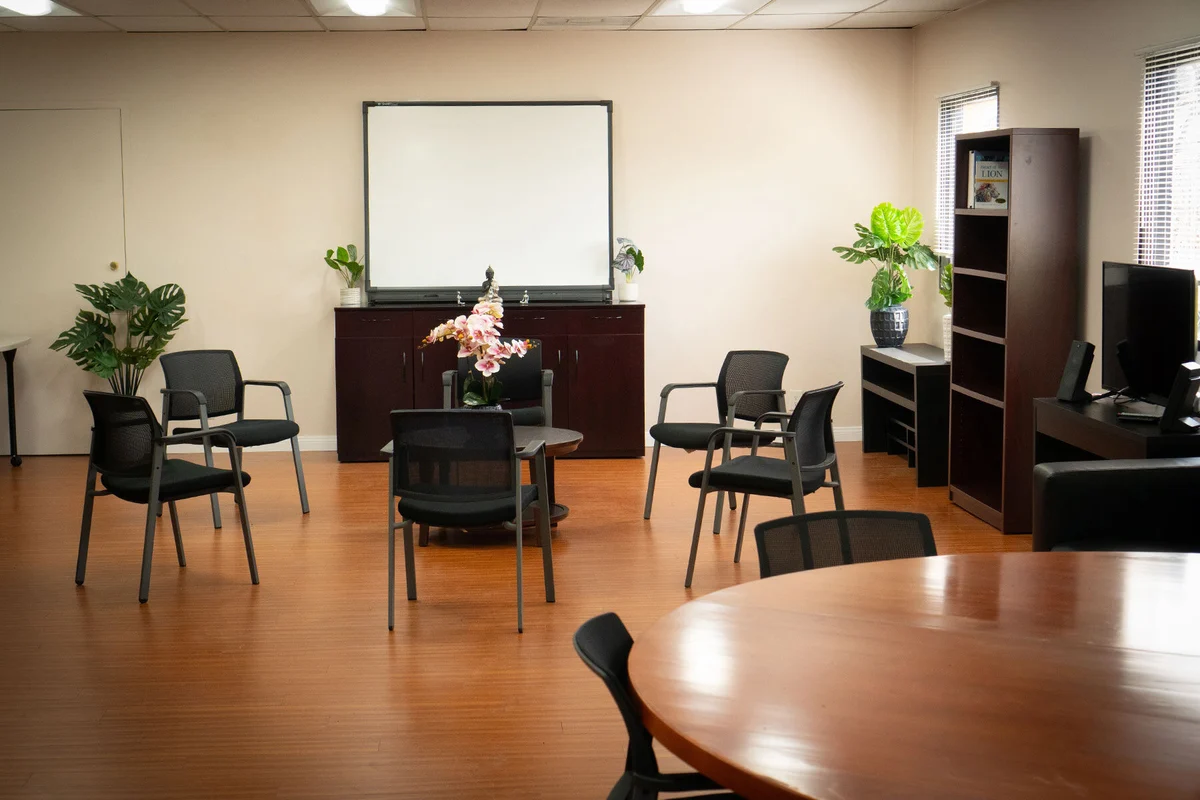 Group counseling room with chairs and whiteboard