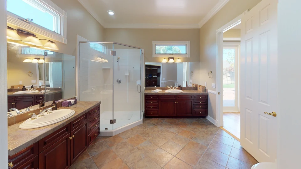 well lit bathroom and shower area