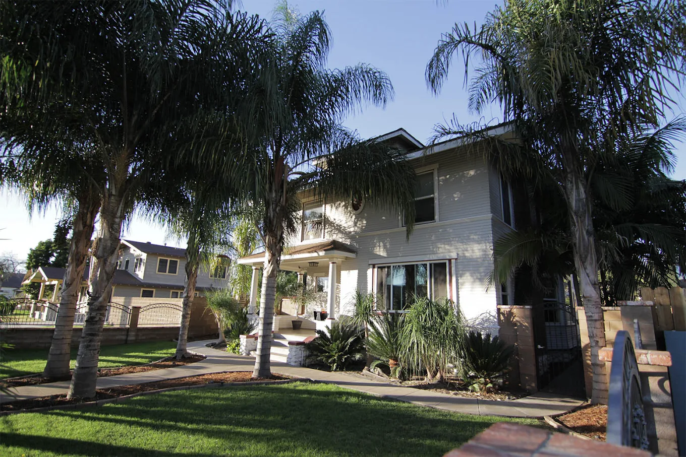 Palm-lined exterior of His House 9th Street in Upland