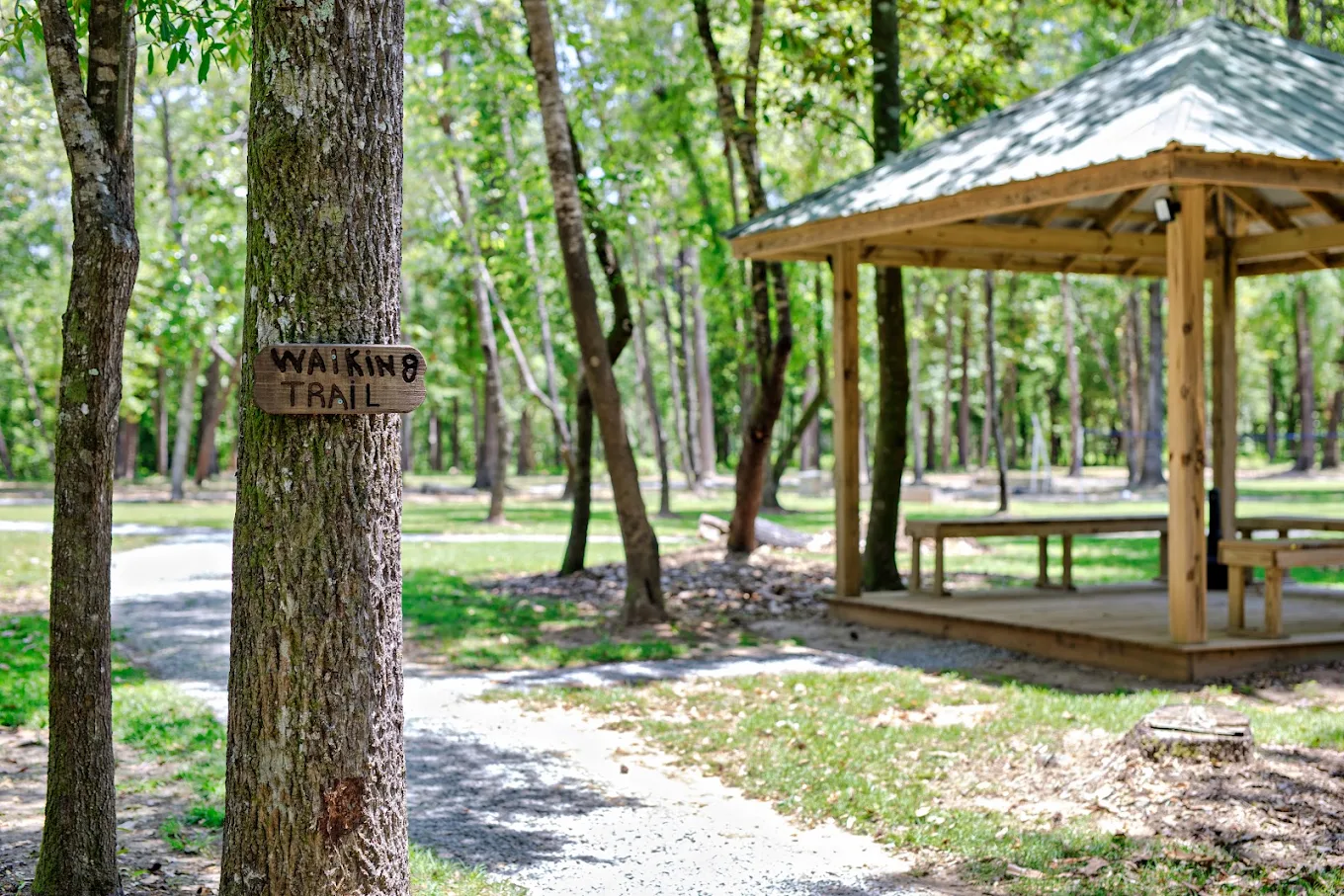Walking trail with gazebo surrounded by trees