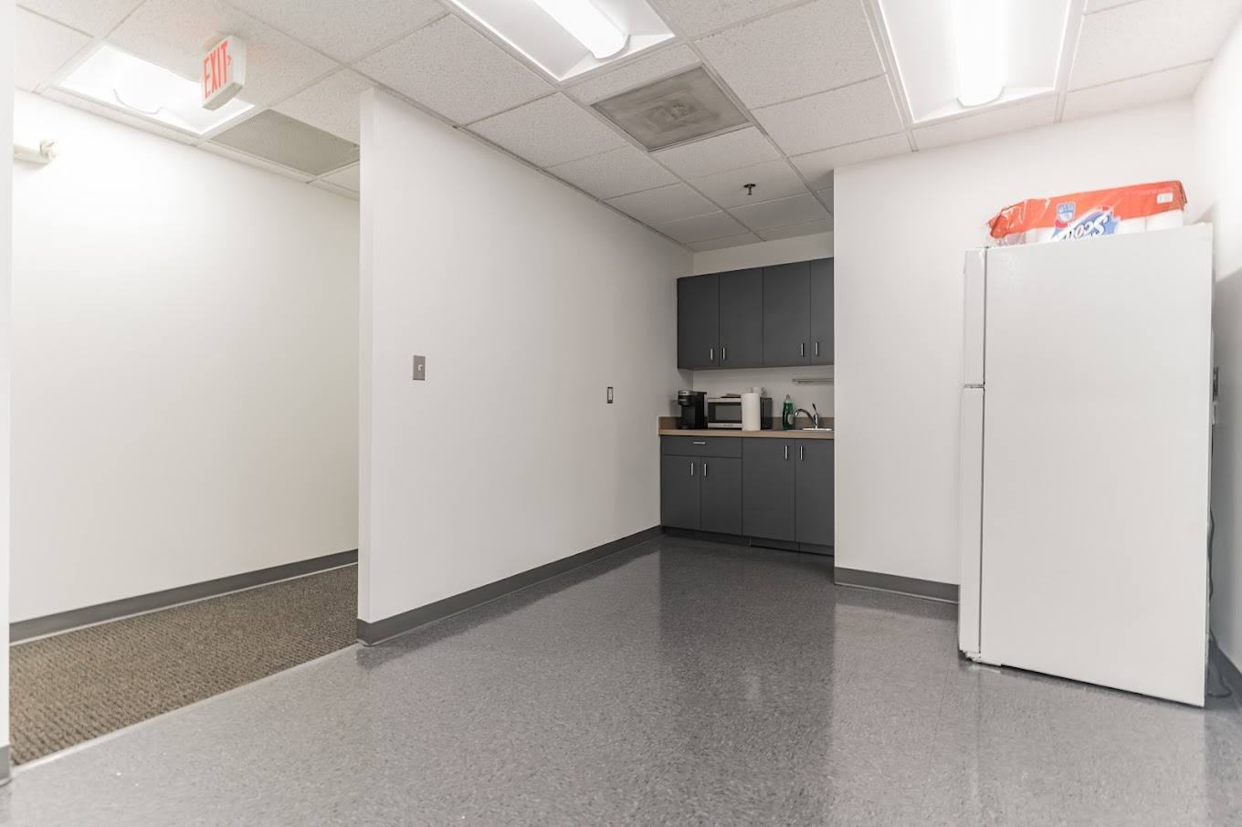 Small pantry with fridge, sink, and cabinets