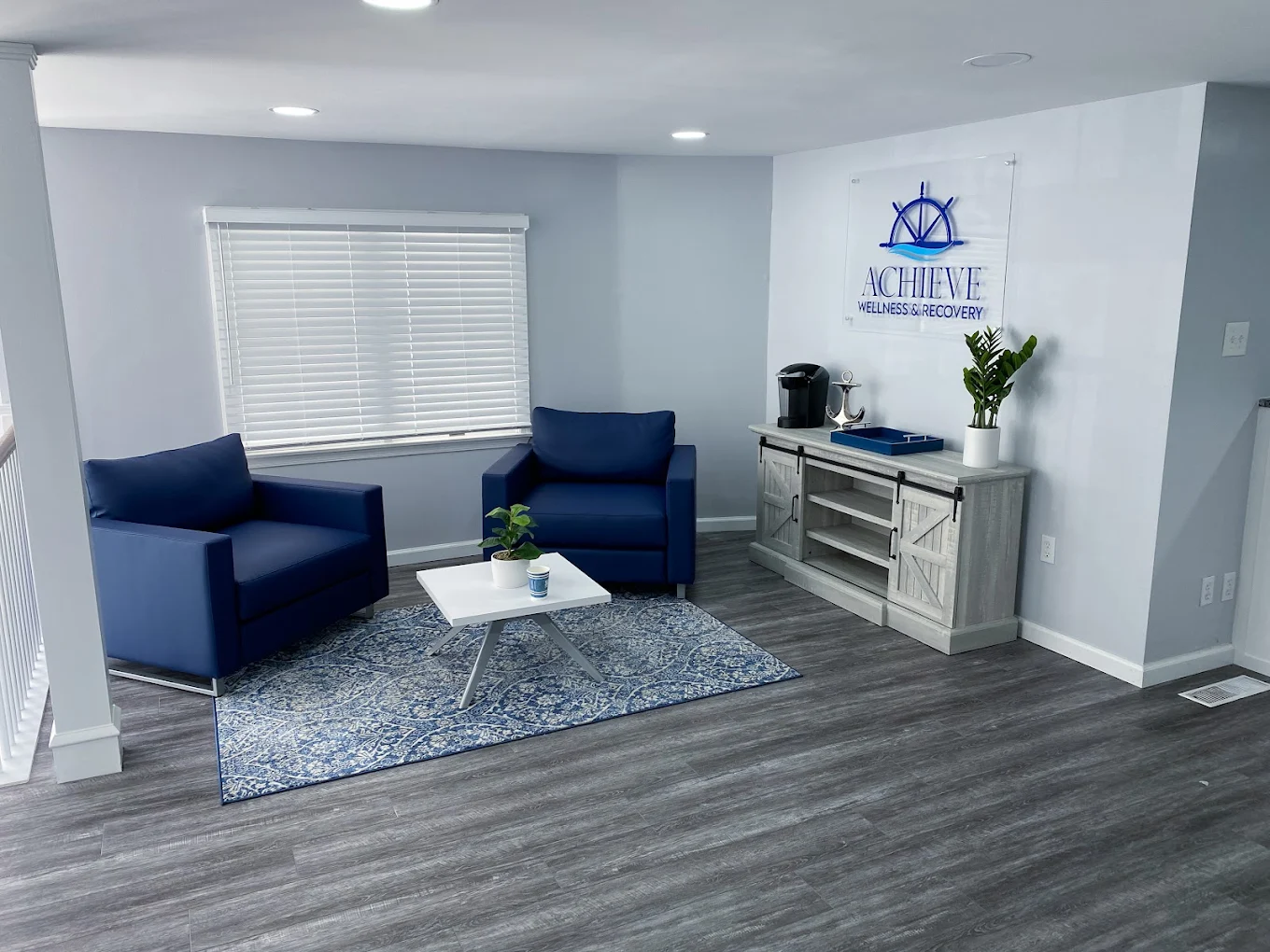 Relaxed space with blue chairs and coffee table