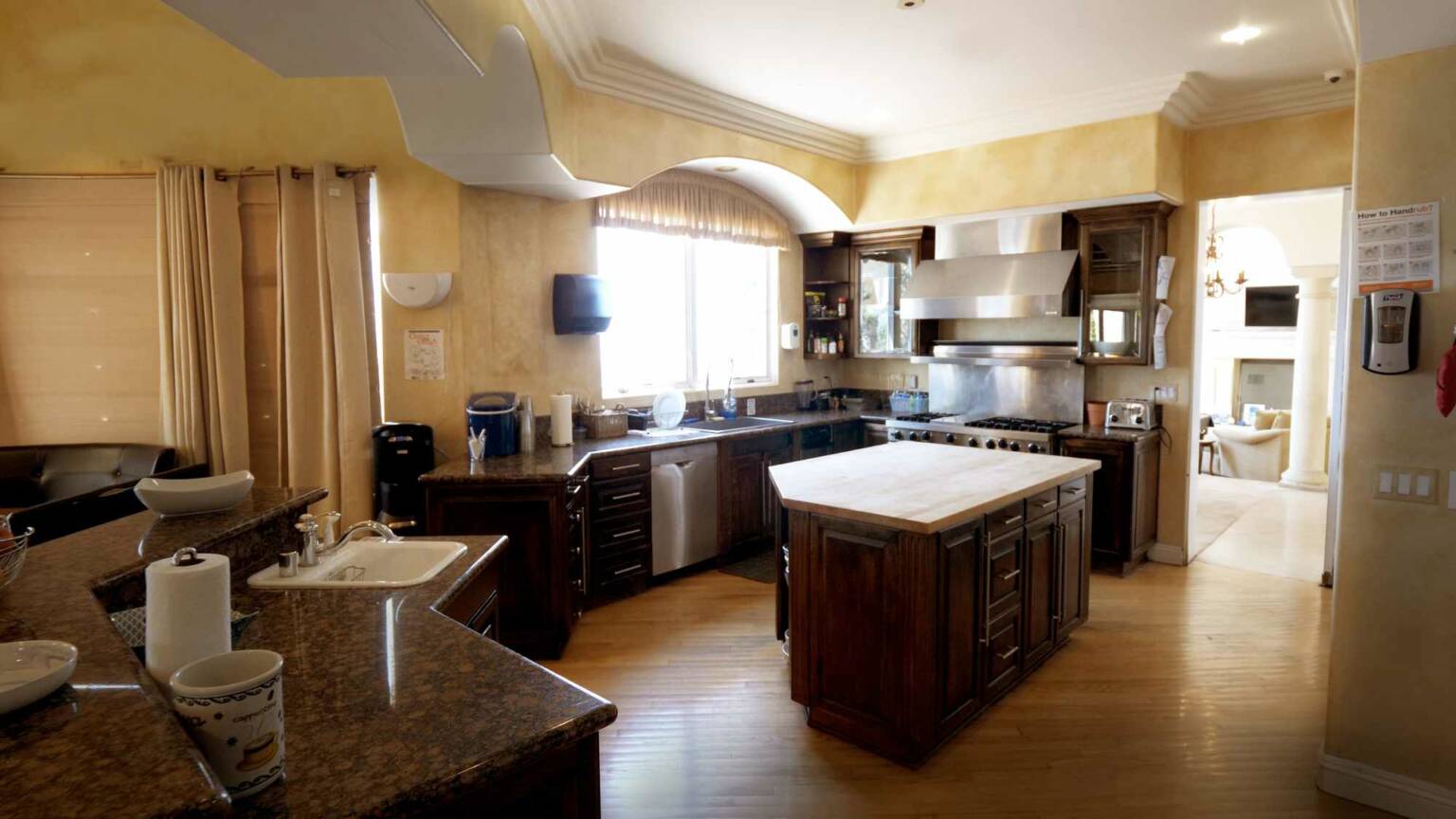 Fully equipped kitchen with island and stainless appliances