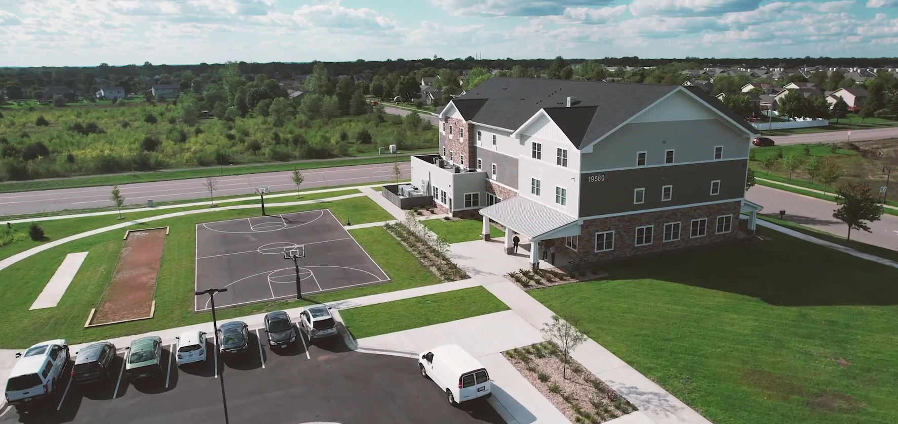 Basketball court and walking paths beside residential treatment center