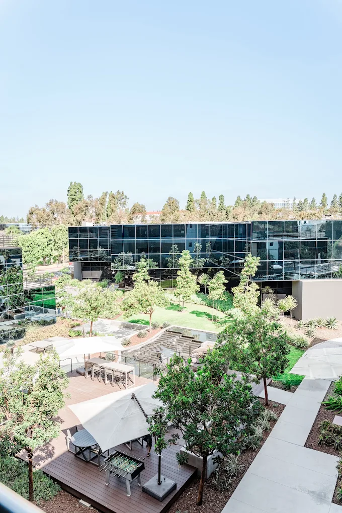 Landscaped courtyard with outdoor seating and walking paths