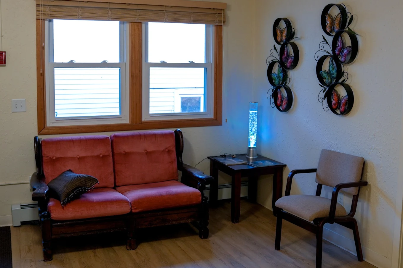 Private therapy room with sofa and chairs