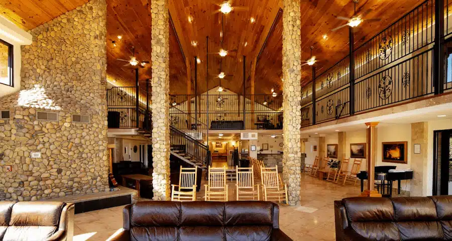 Spacious lodge interior with stone columns and seating