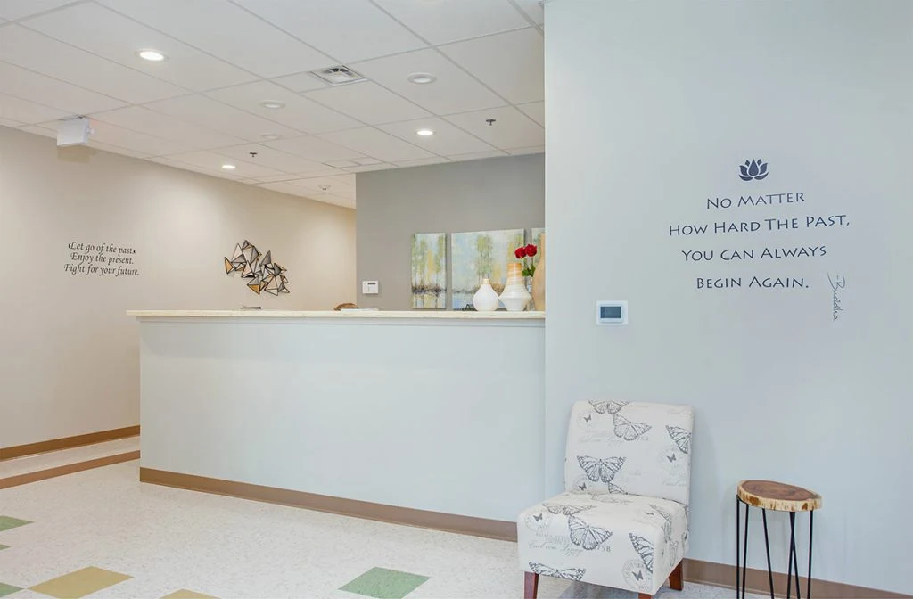 Reception desk and quotes on walls in welcome area