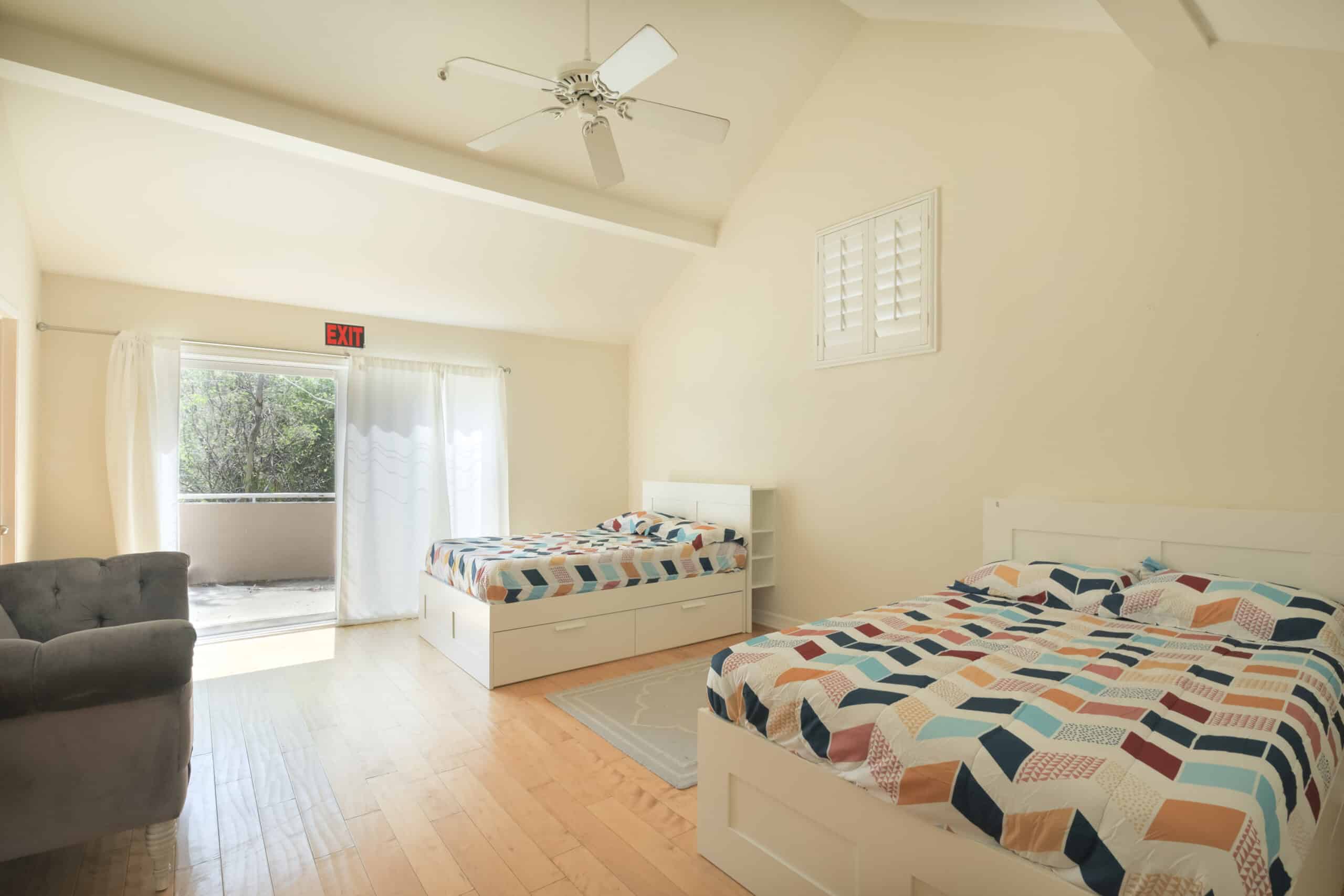 Bedroom with two beds and bright natural light
