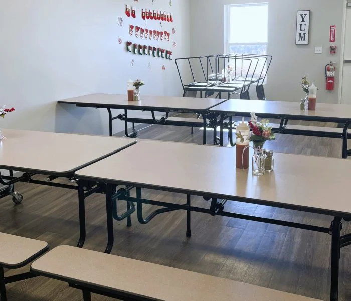 Dining room with tables, benches, and wall decor