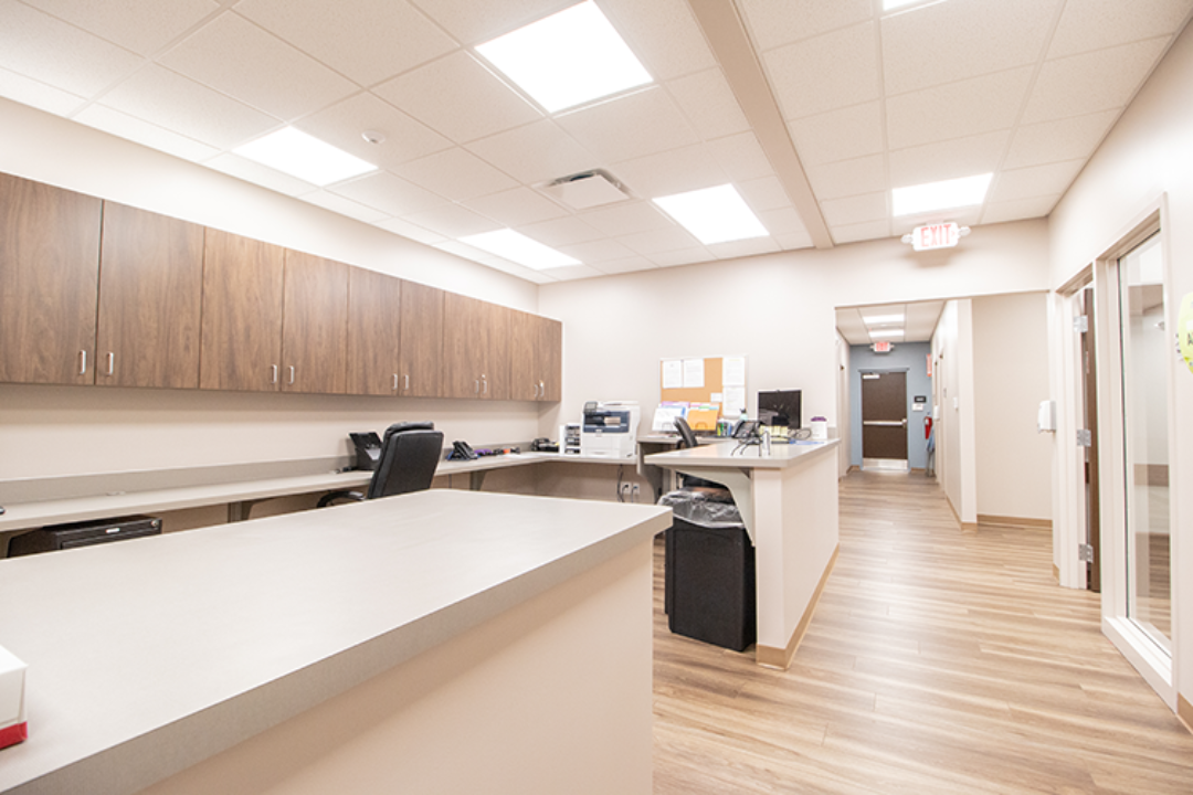 Staff workstation with counters, cabinets, and computers