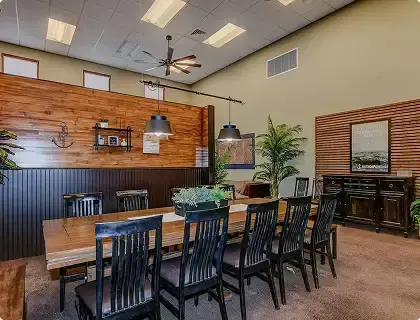 Shared dining room with large tables and seating