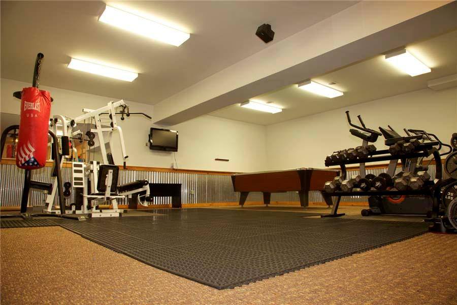 A well-equipped fitness center with weights and cardio machines