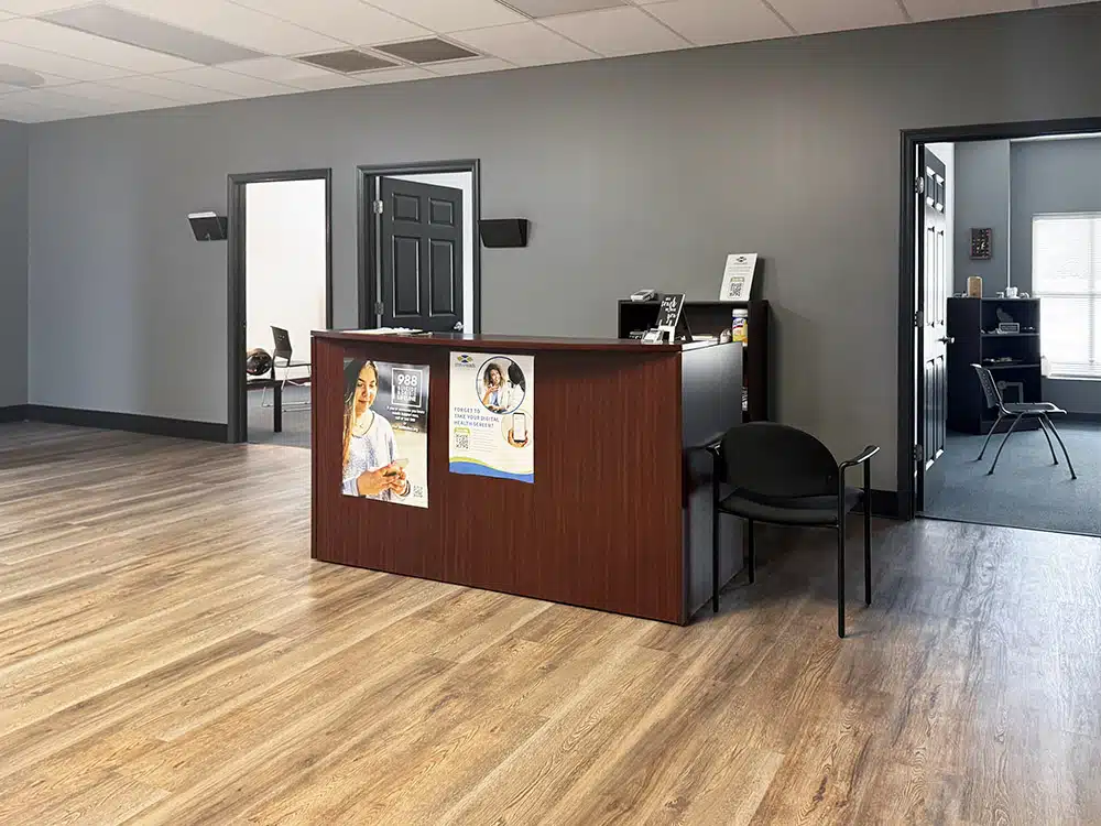 Rehab center reception desk with hallway to counseling rooms