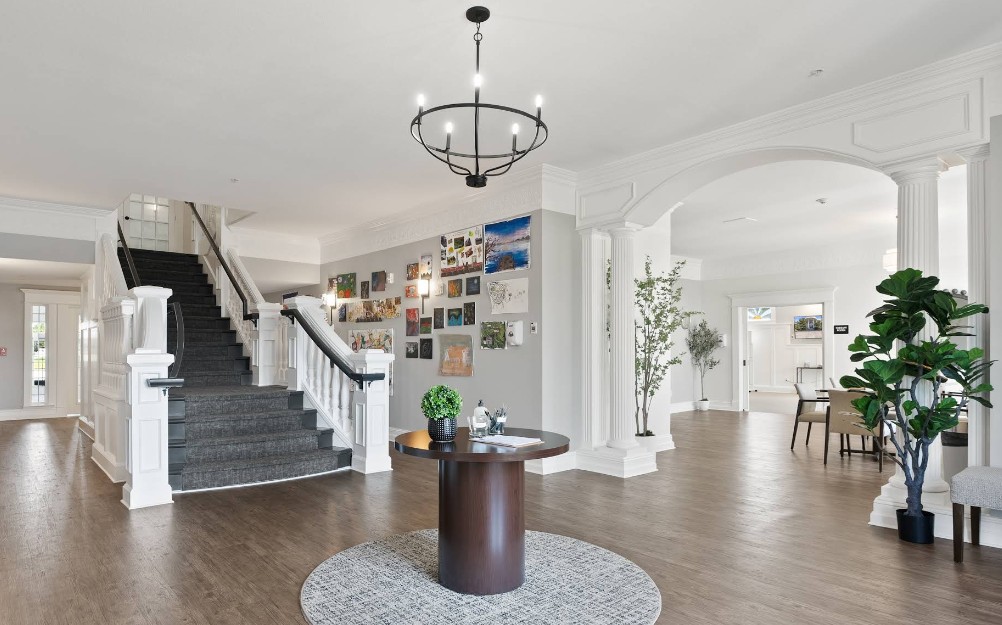Bright lobby with staircase and seating area