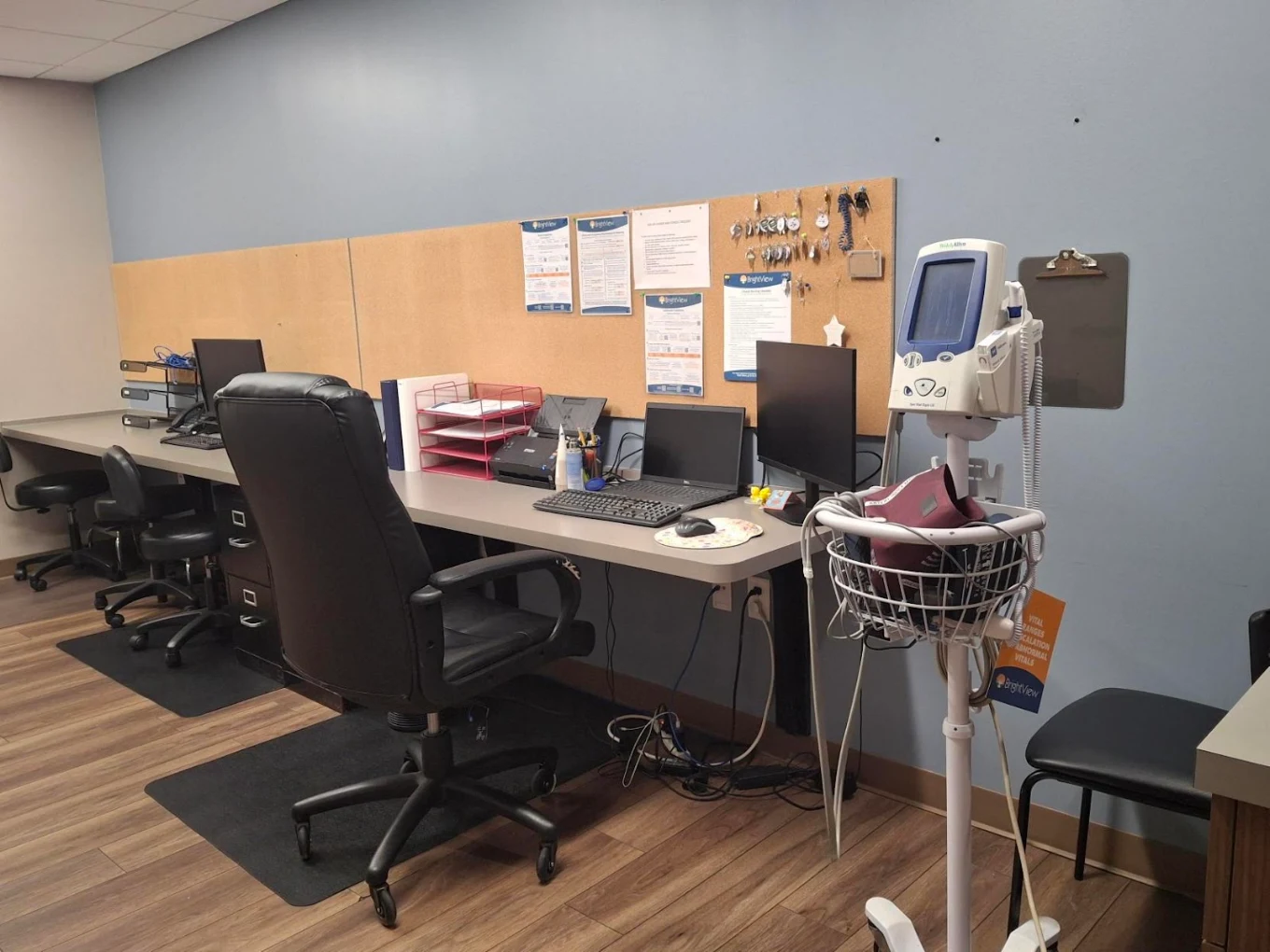 Clinical workstation with computers and medical equipment