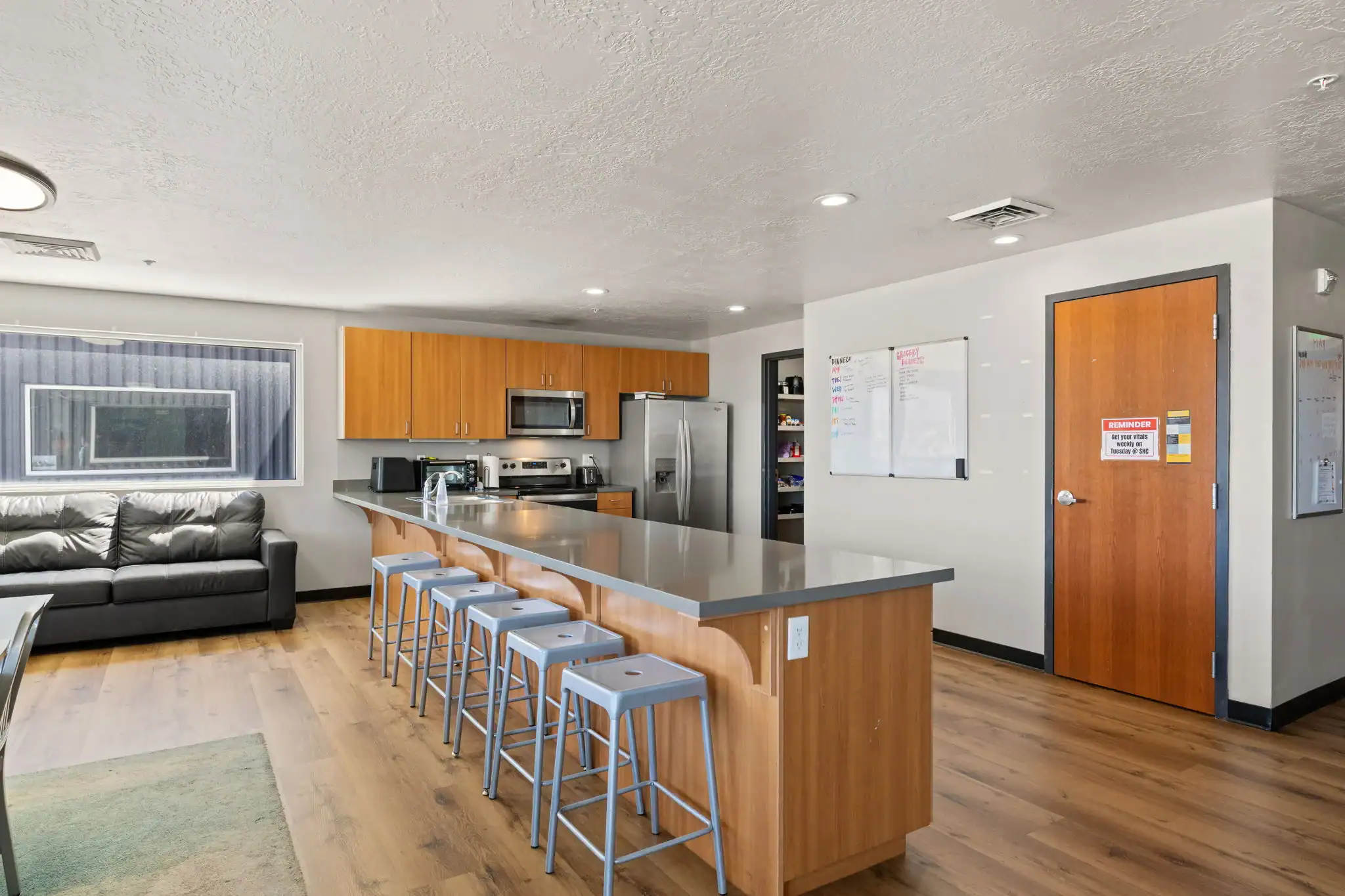 Shared kitchen with island seating and modern appliances