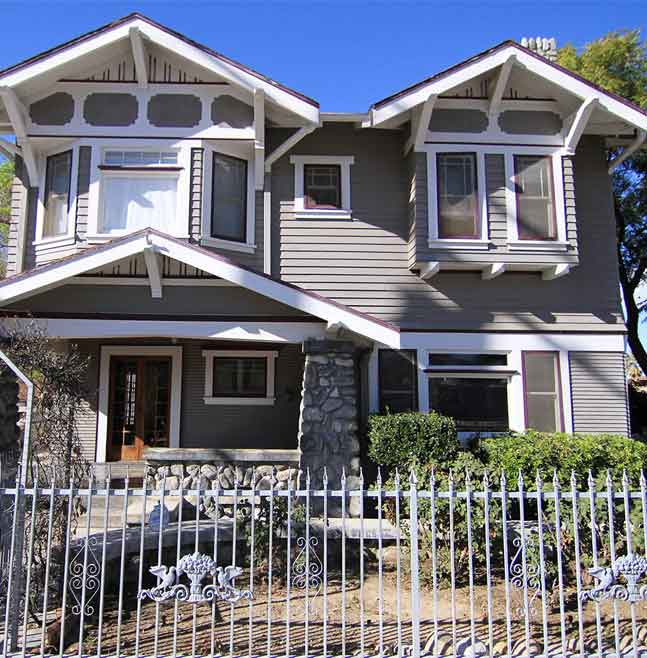 Craftsman-style rehab center with stone columns and white trim