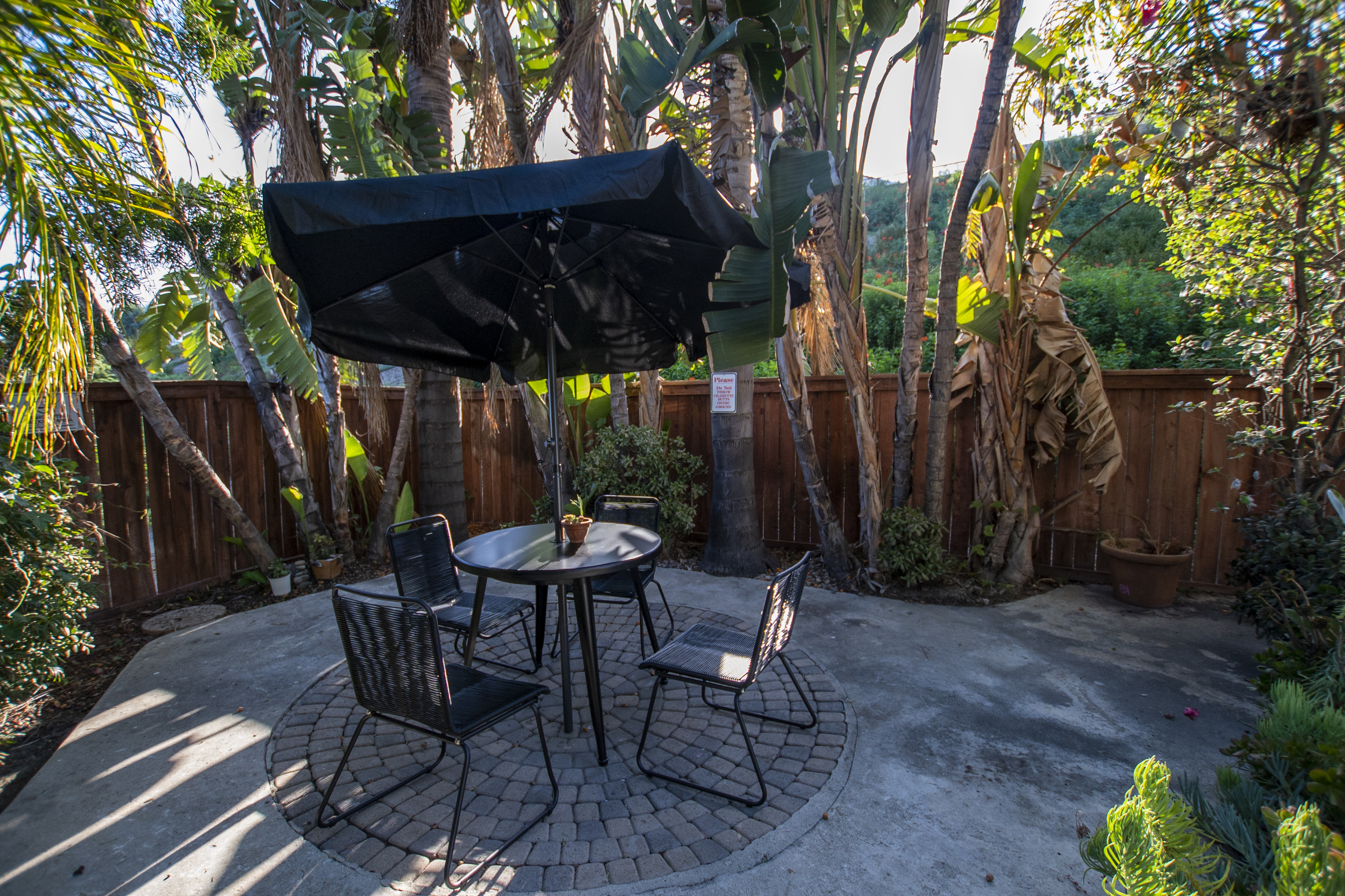 Outdoor seating area shaded by large umbrella