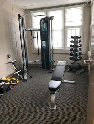 Fitness room with weights and cable machine